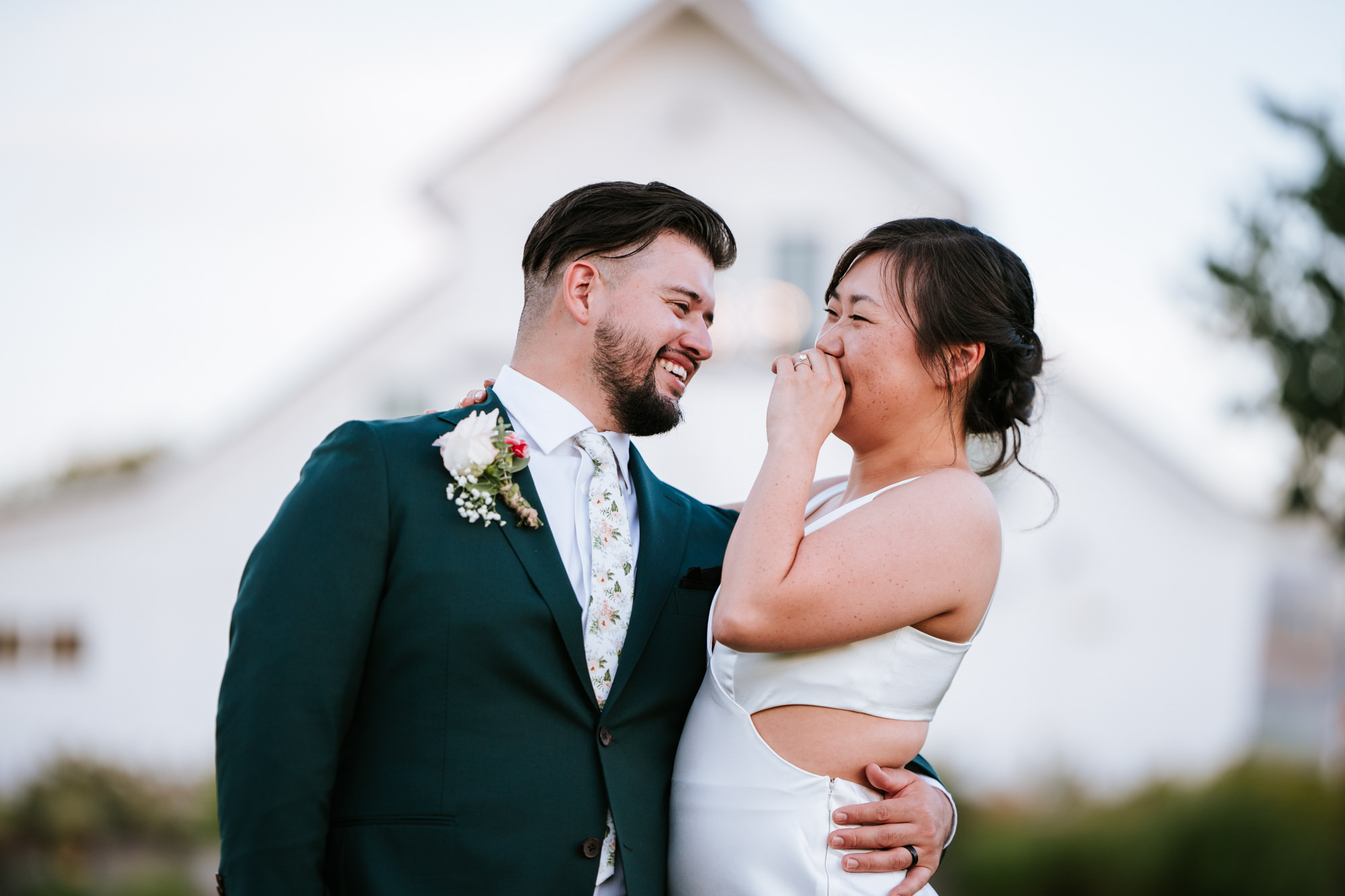 couple laughing together on their wedding day