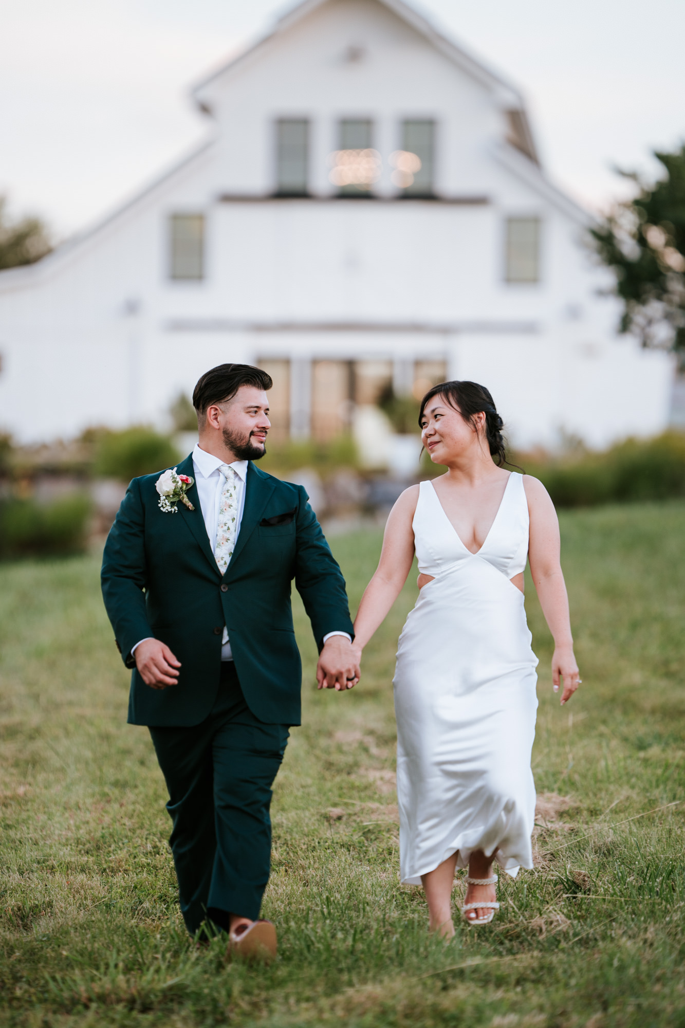 bride and groom walking together during their leesburg wedding day
