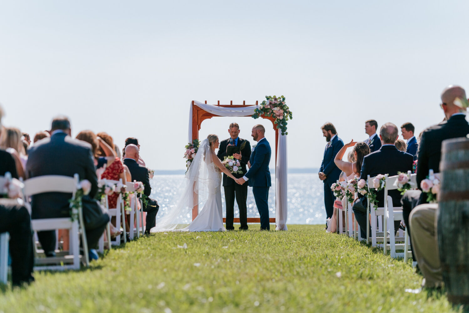 bride and groom at the altar together during their wedding ceremony at pavilion at weatherly