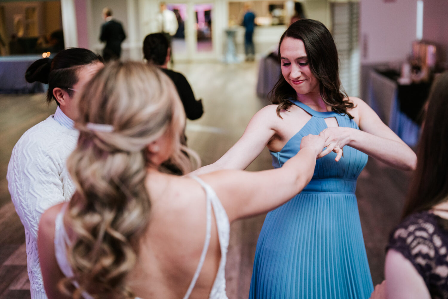 bride dancing with bridesmaid 