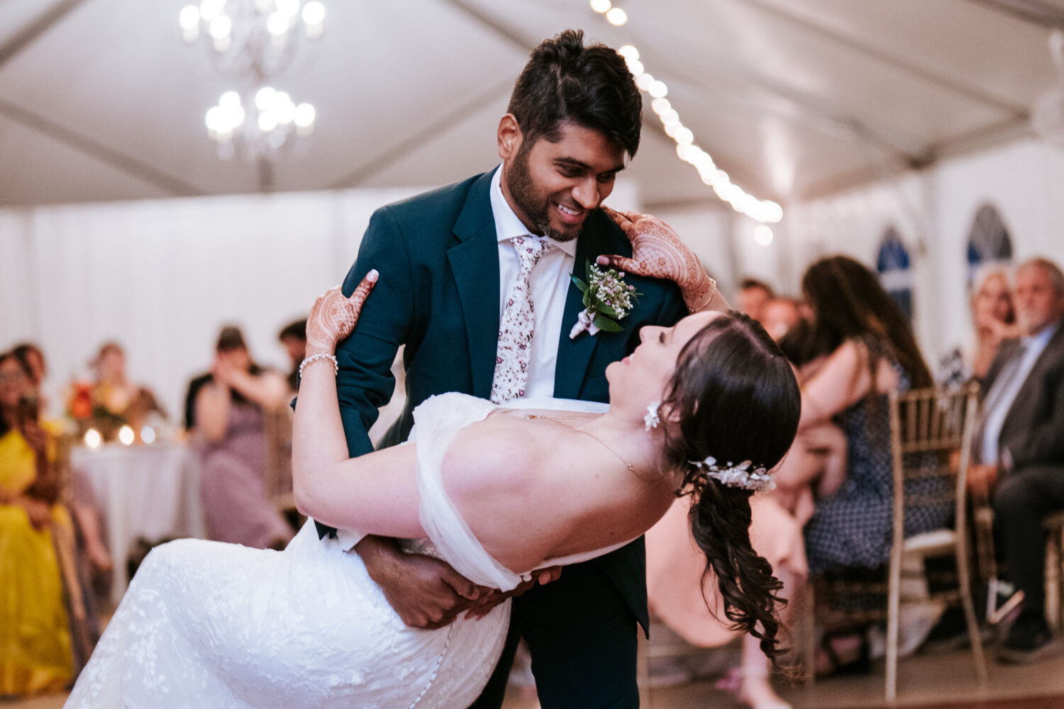 groom dipping his bride during their first dance on their wedding day