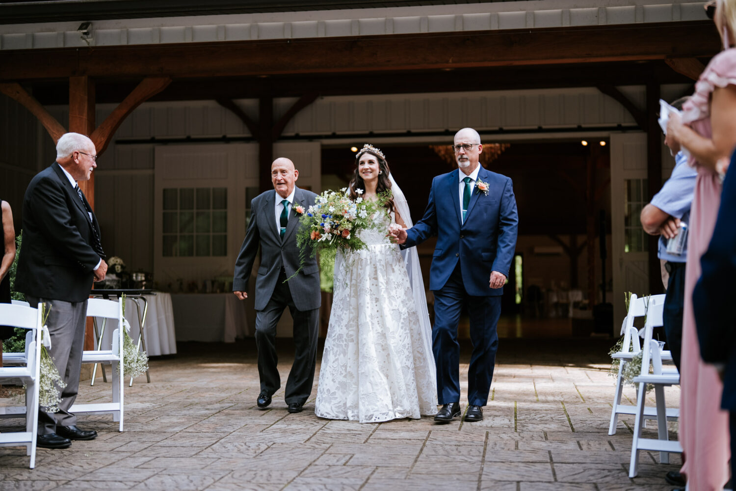 bride walking down the aisle during her historic rosemont springs wedding