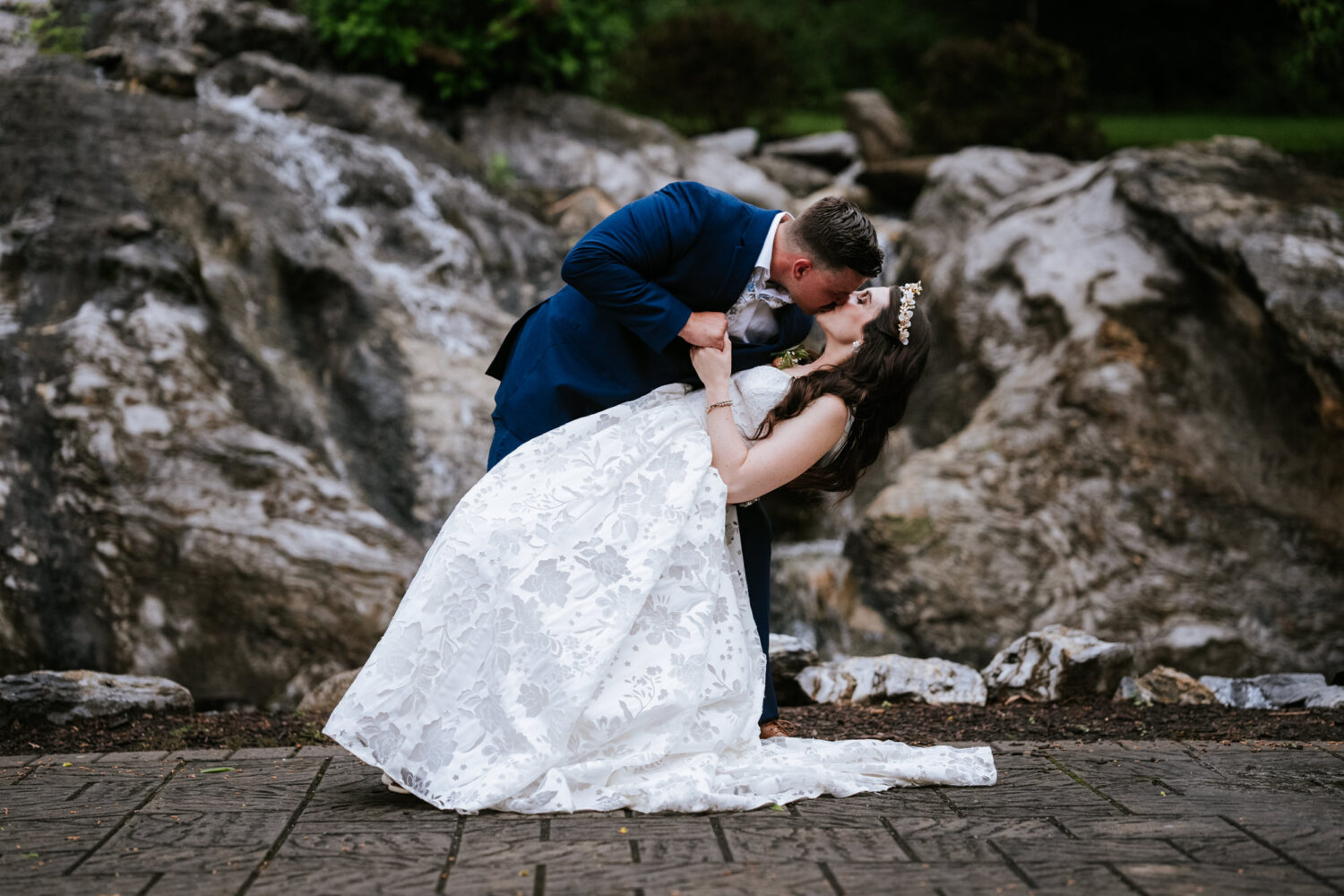 bride and groom dip kiss during their berryville virginia wedding