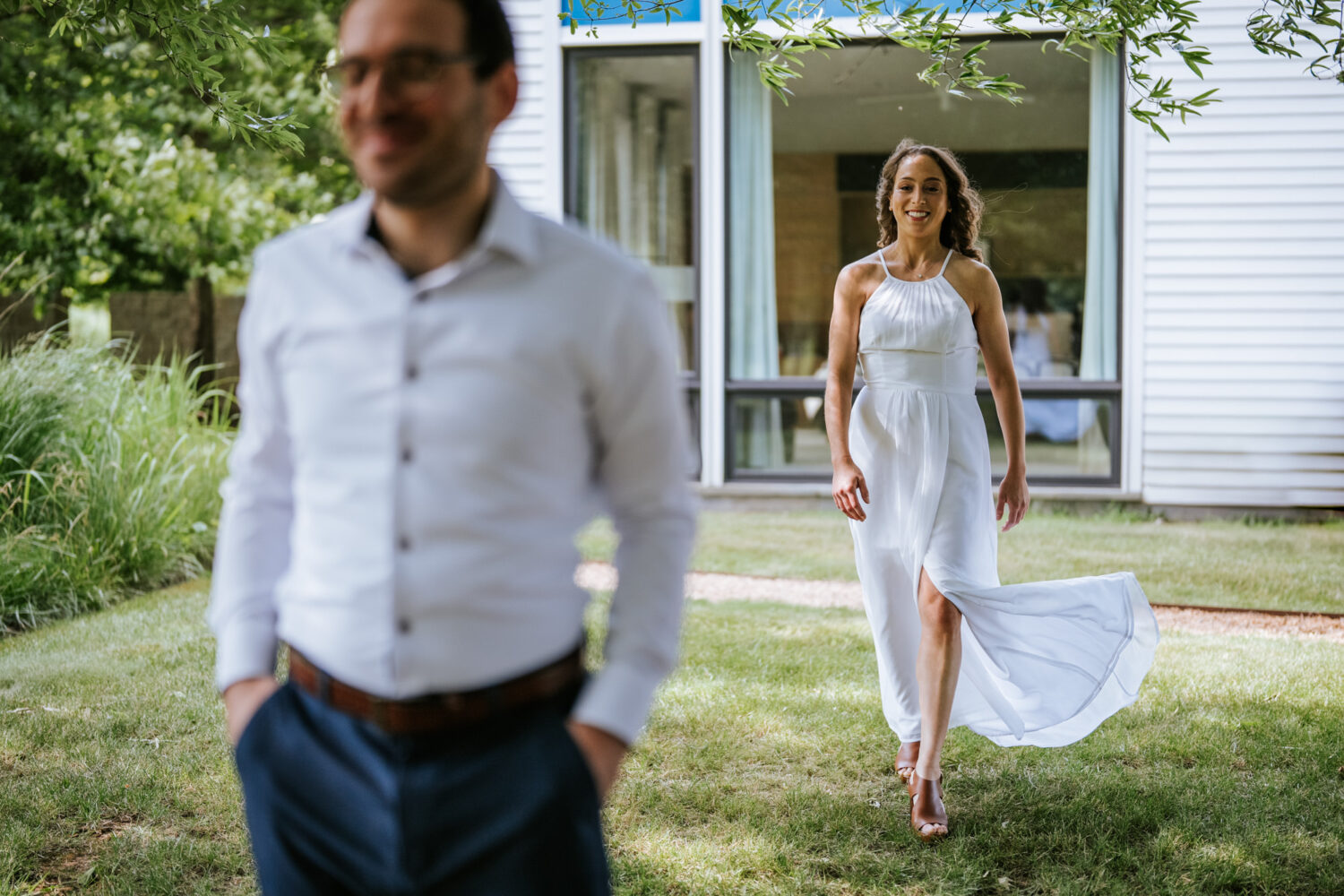 bride walking up to groom for their first look on their wedding day