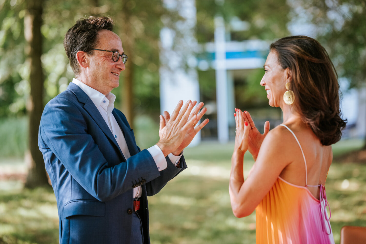 father and mother of the bride having fun playing the mirror dance game