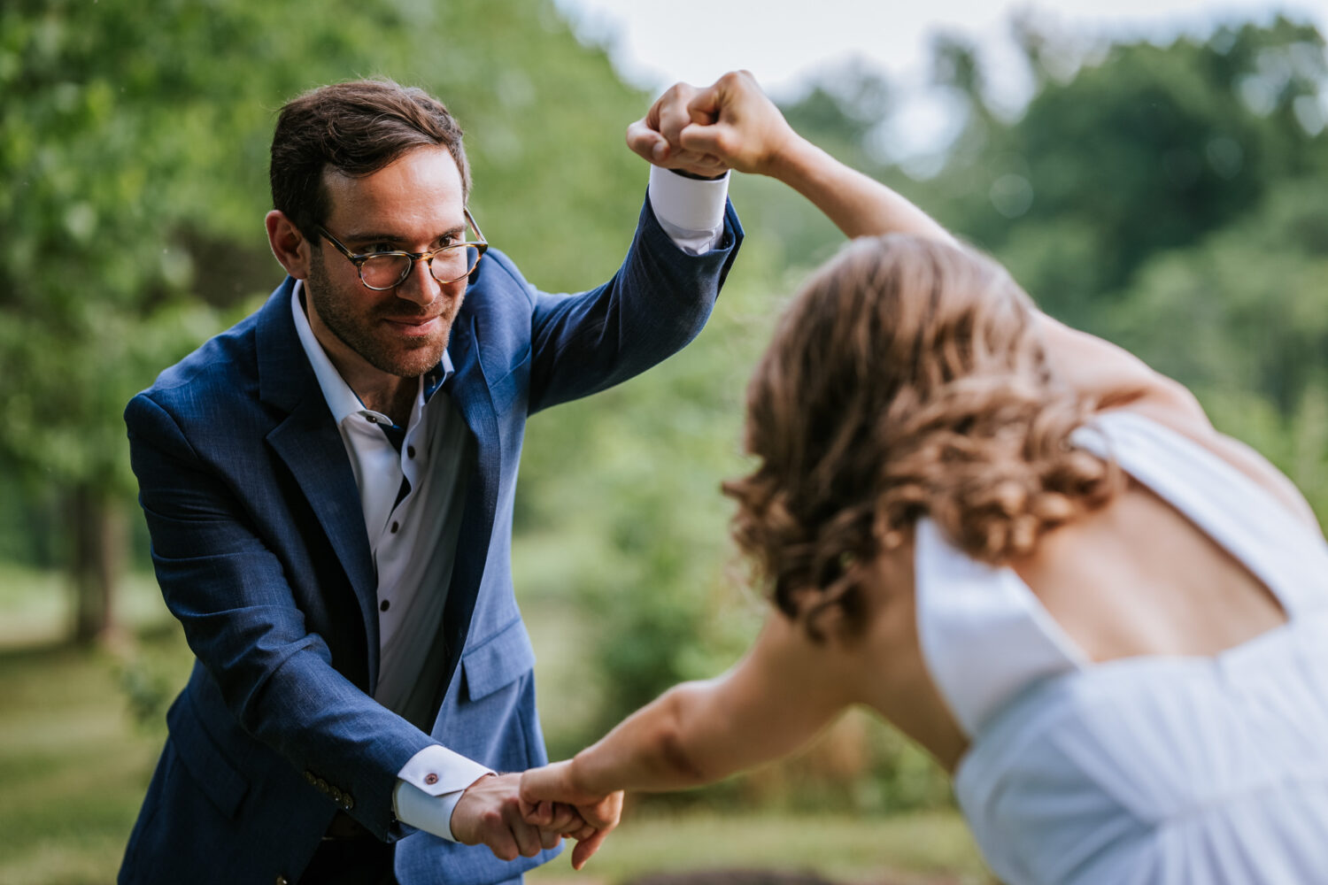 bride and groom portrait with fist bumps