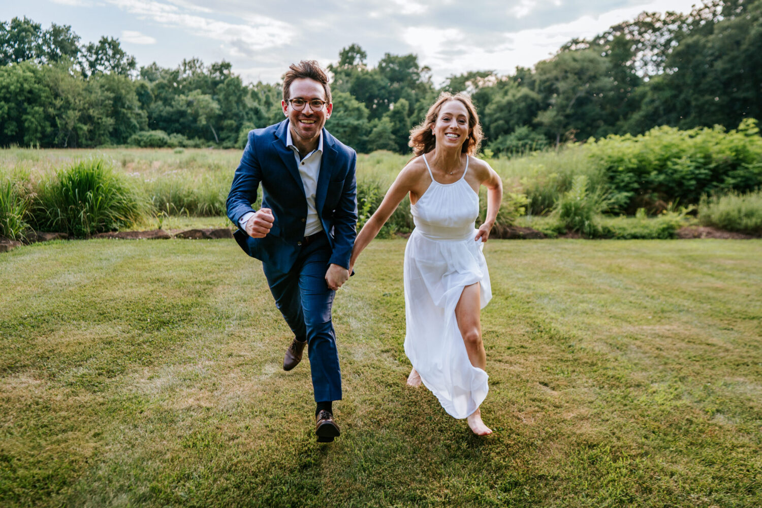 bride and groom running together on their wedding day