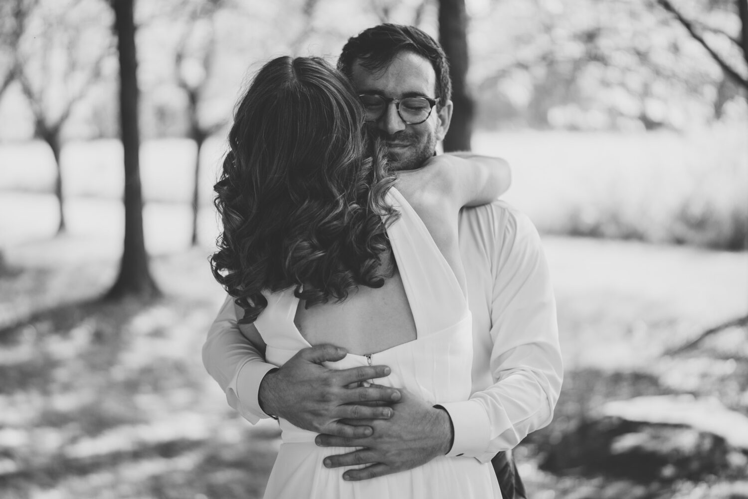 bride and groom hugging after seeing each other for the first time on their wedding day