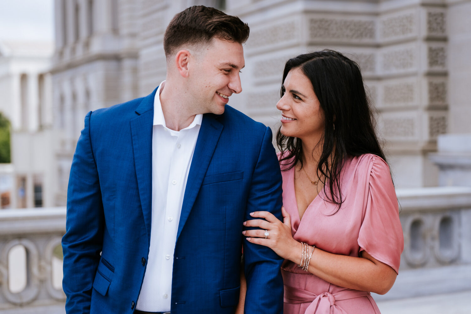 bride and groom looking at each other and smiling during their washington dc engagement session