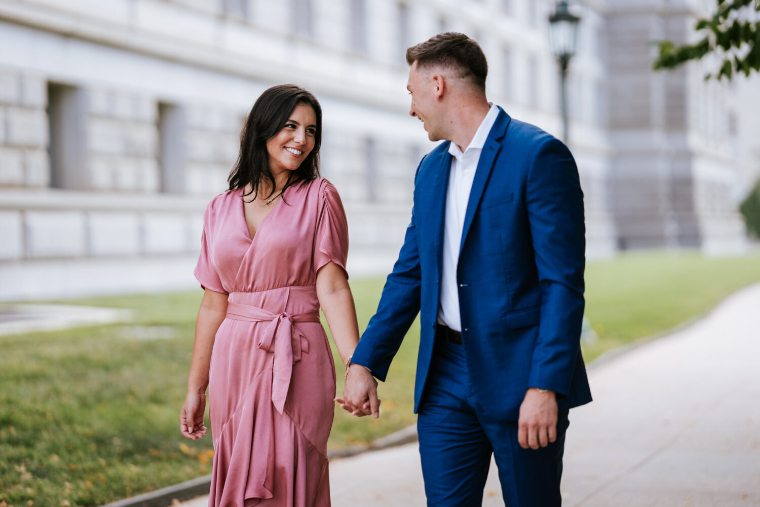 couple walking together during their washington dc library of congress engagement session