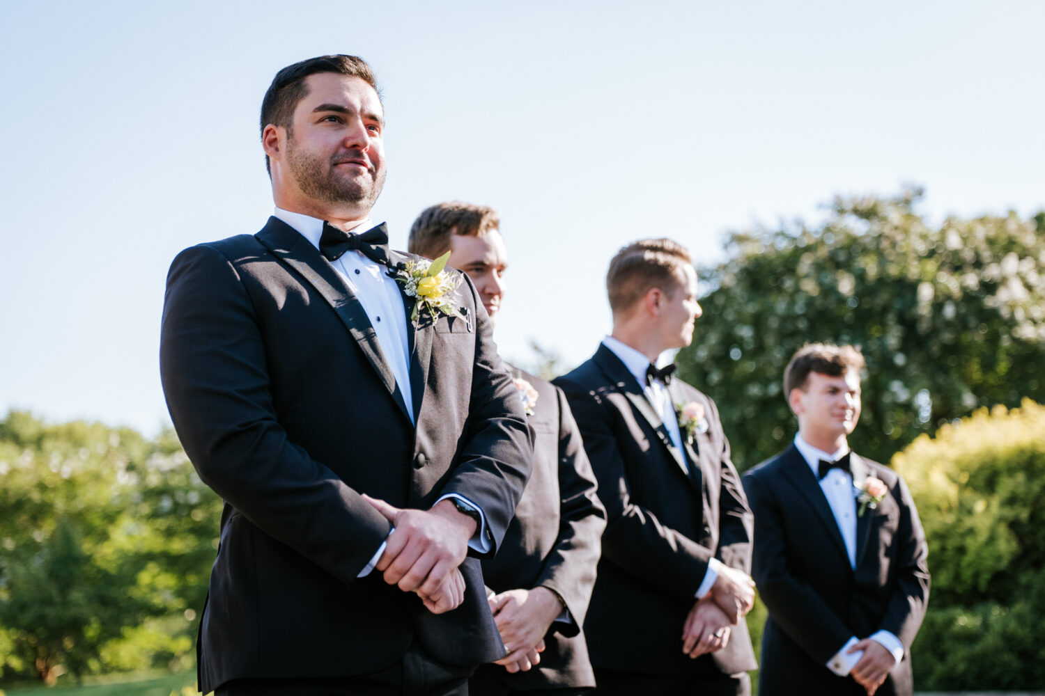 groom reacting to seeing his bride walk down the aisle