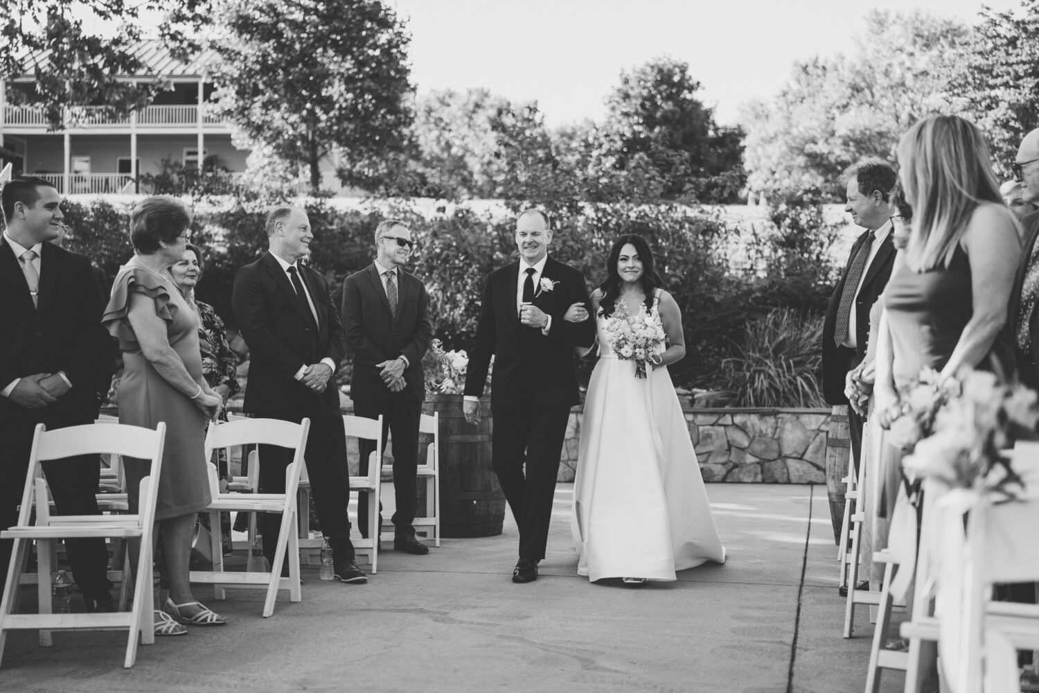 bride walking down the aisle with her father by her side