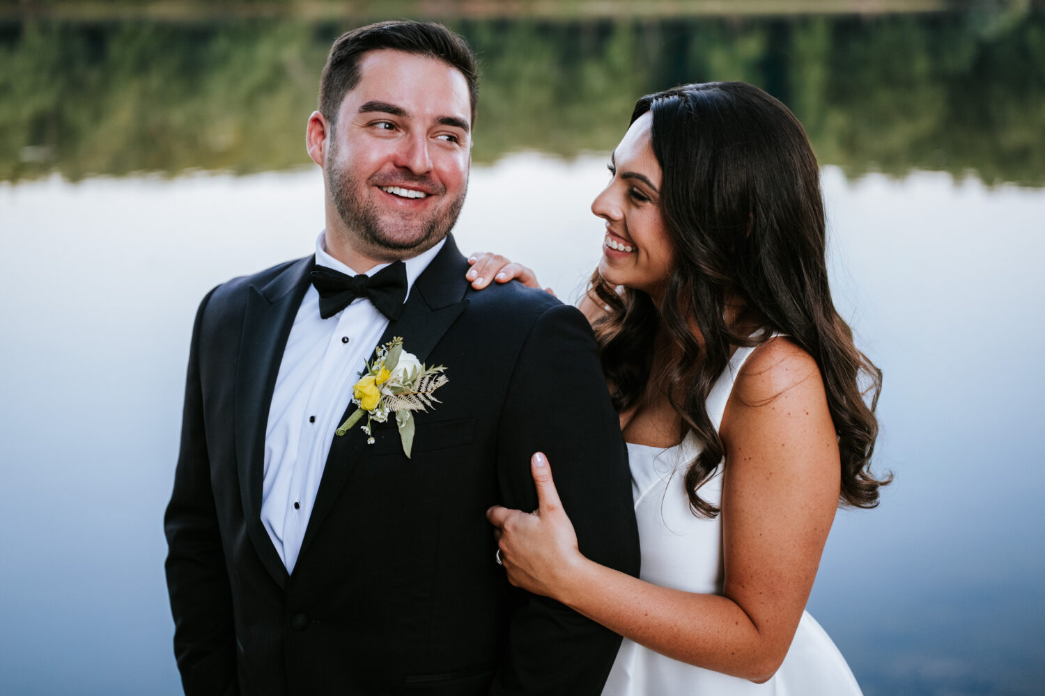 bride and groom portrait alongside the potomac river 