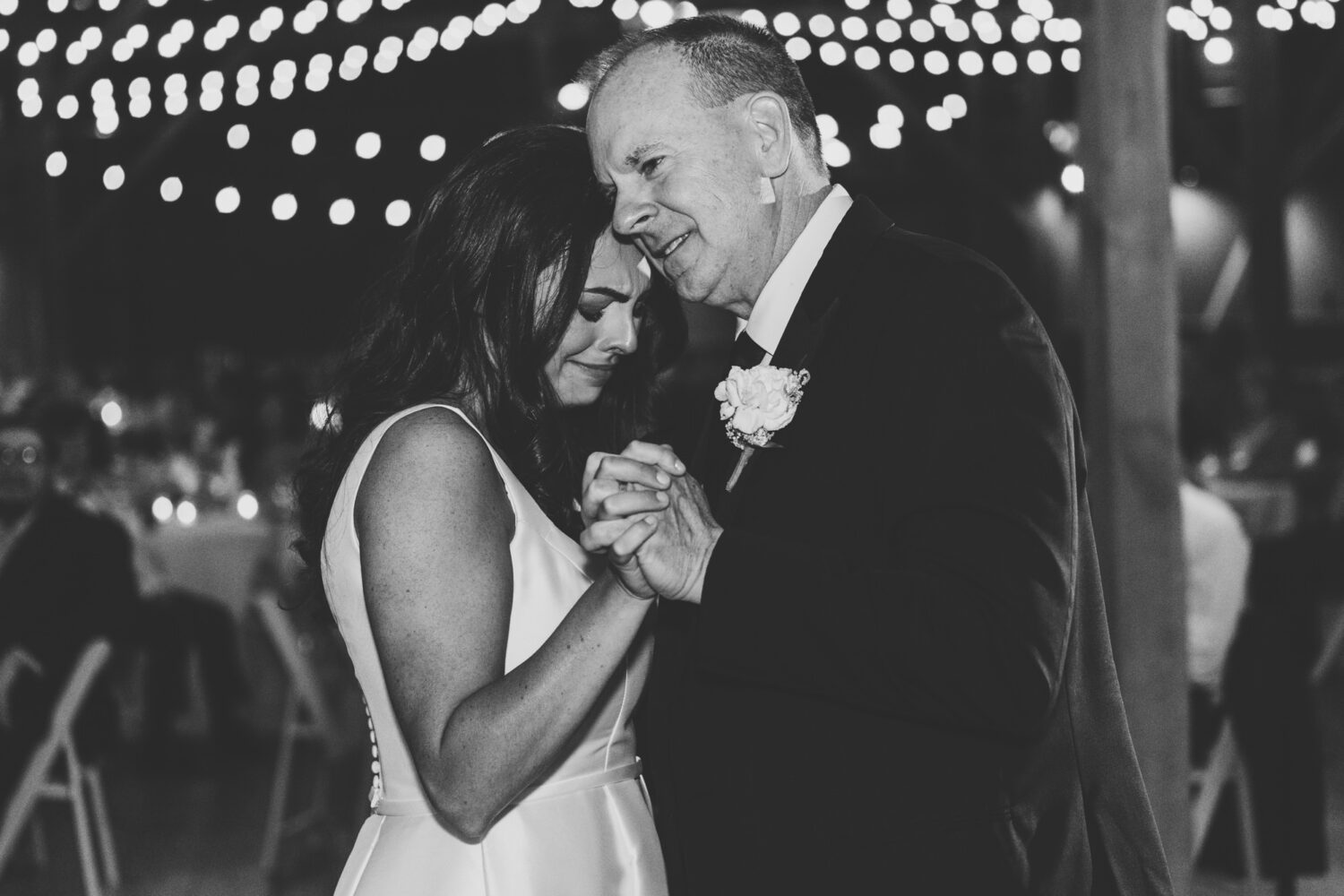 father of the bride dancing with his daughter on her wedding day