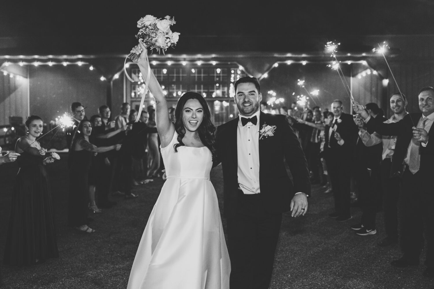 bride and groom walking during their sparkler exit on their wedding day