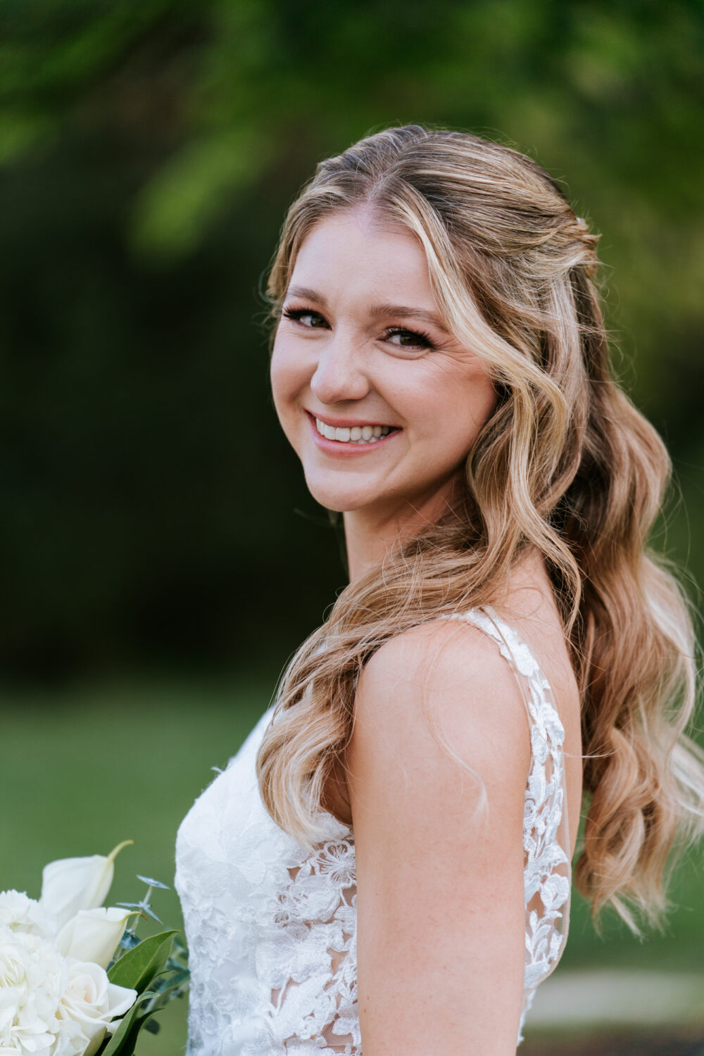 portrait of the bride smiling on her Sweeney Barn wedding day