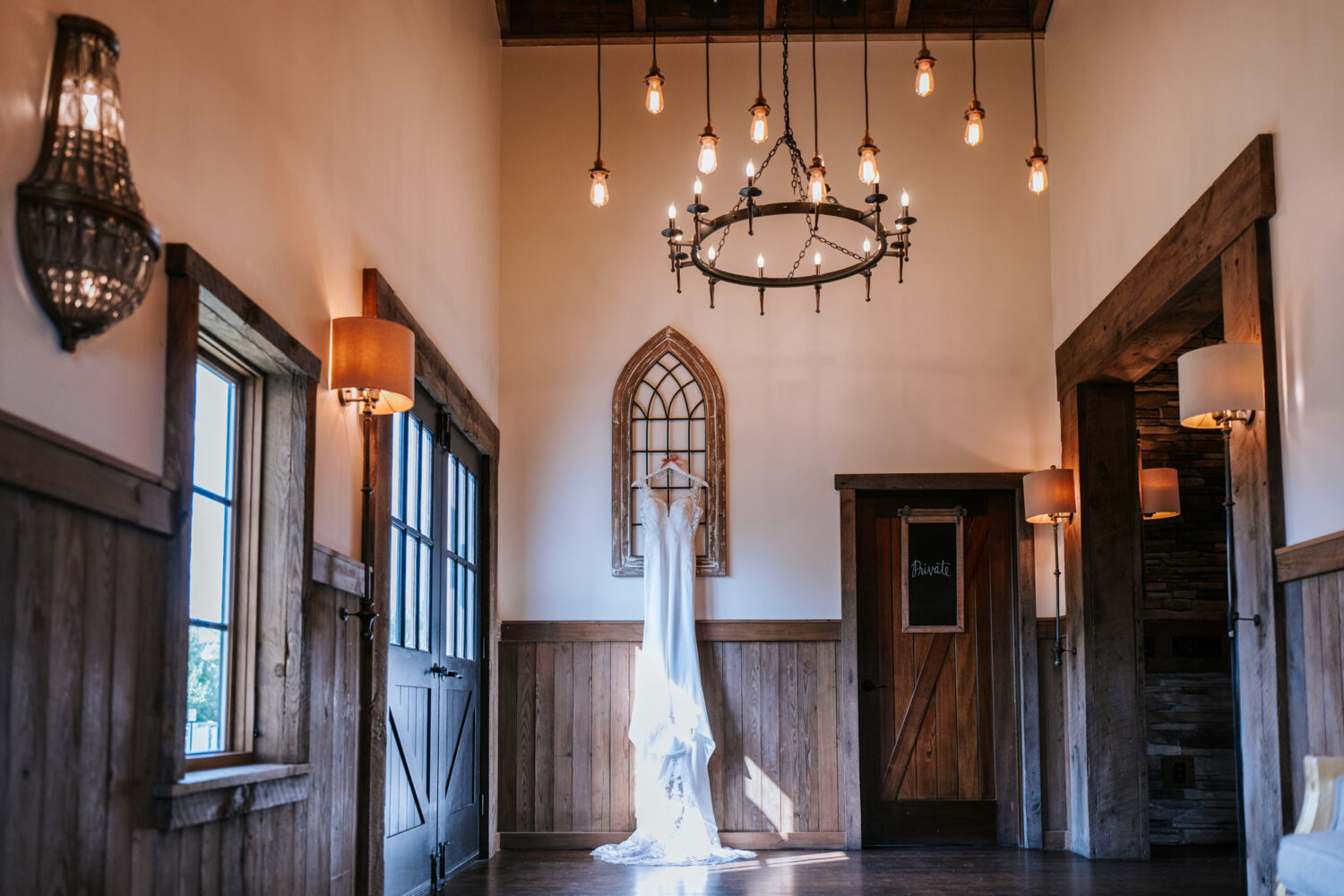 wedding dress hanging during a virginia wedding day at the Sweeney Barn in Manassas