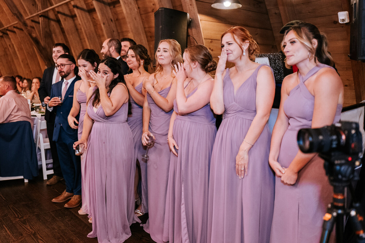 wedding party crying while watching the father and daughter dance