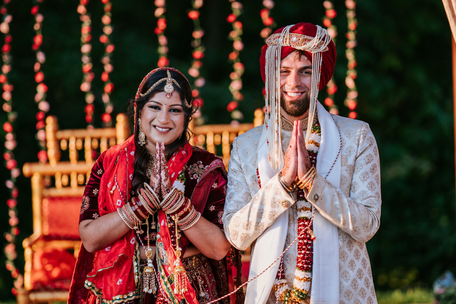 bride and groom smiling and facing their wedding guests during their woodlands wedding day