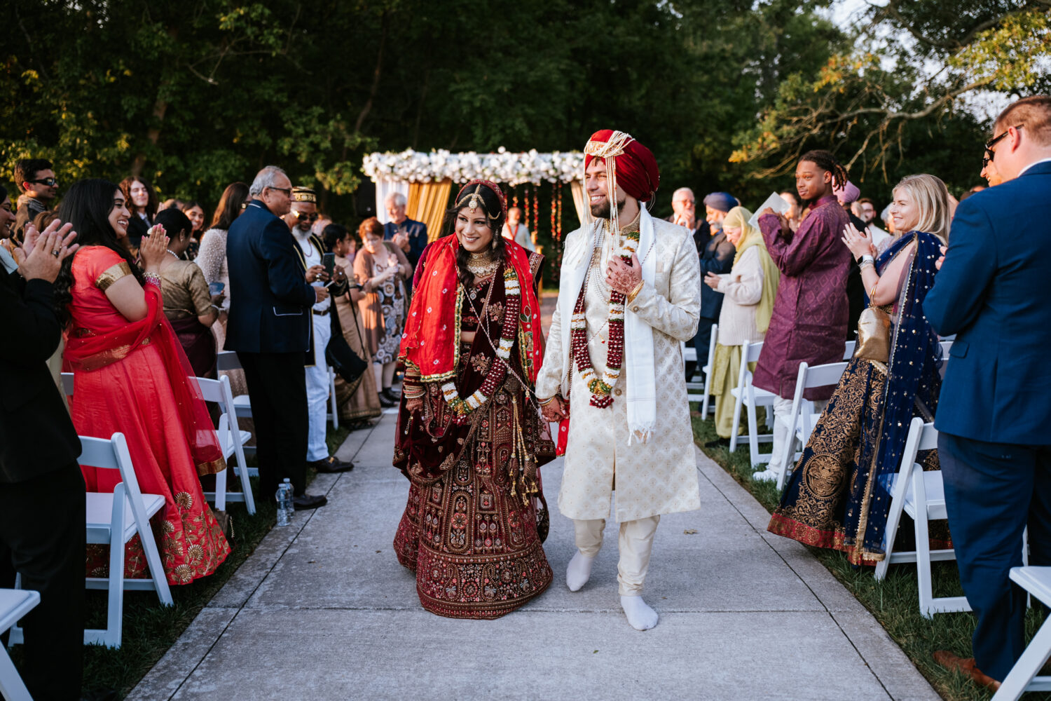 bride and groom exiting their hindu wedding ceremony