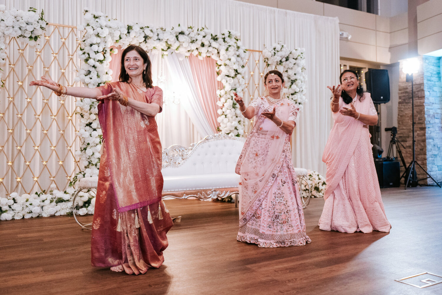 family of the bride performing a choreographed dance during her hindu wedding day