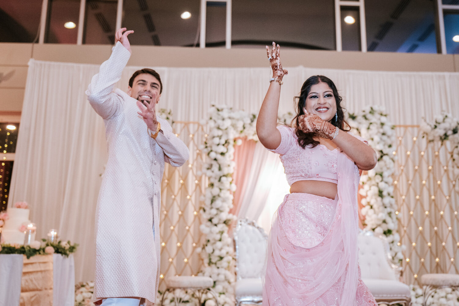 bride and groom doing a choreographed performance for their wedding guests