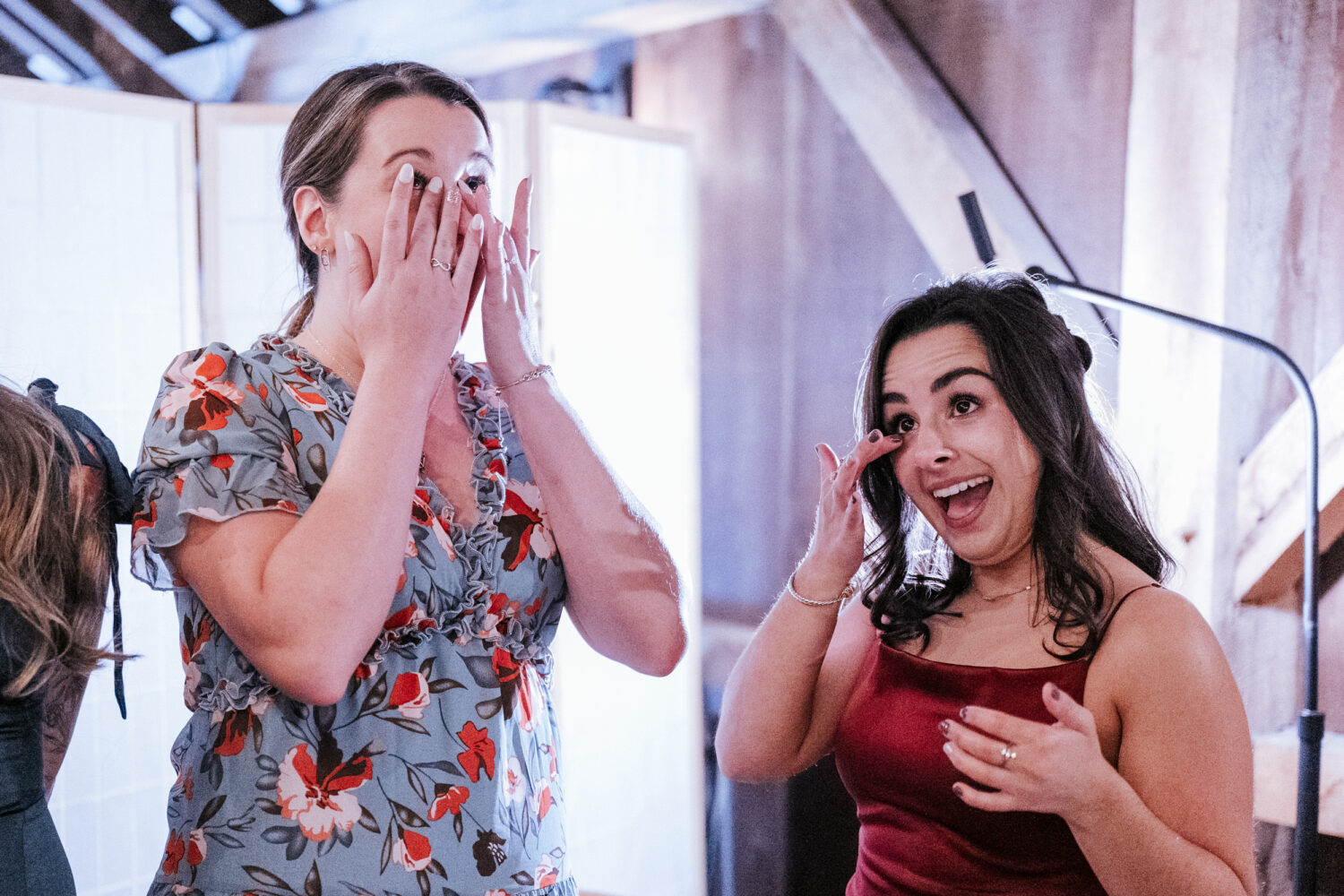 friends of the bride getting emotional after seeing their friend on her wedding day