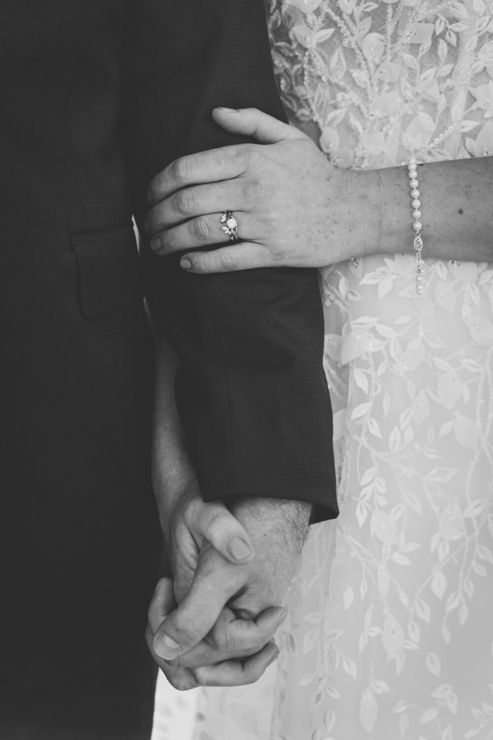 bride and groom holding hands on their Kalero Vineyard wedding day