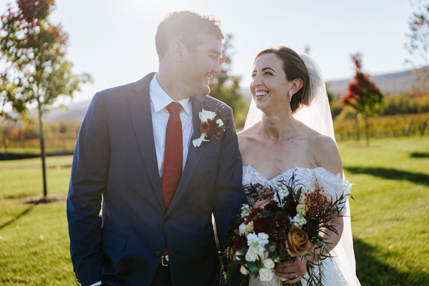 bride and groom walking on their wedding day at Kalero Vineyard in Purcellville, Virginia