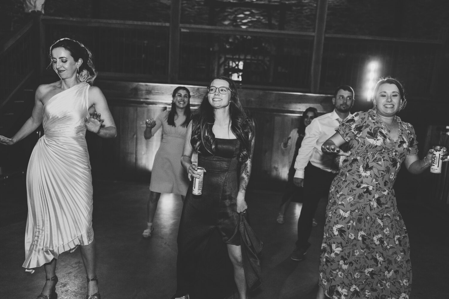 bride dancing with her best friends on her wedding day