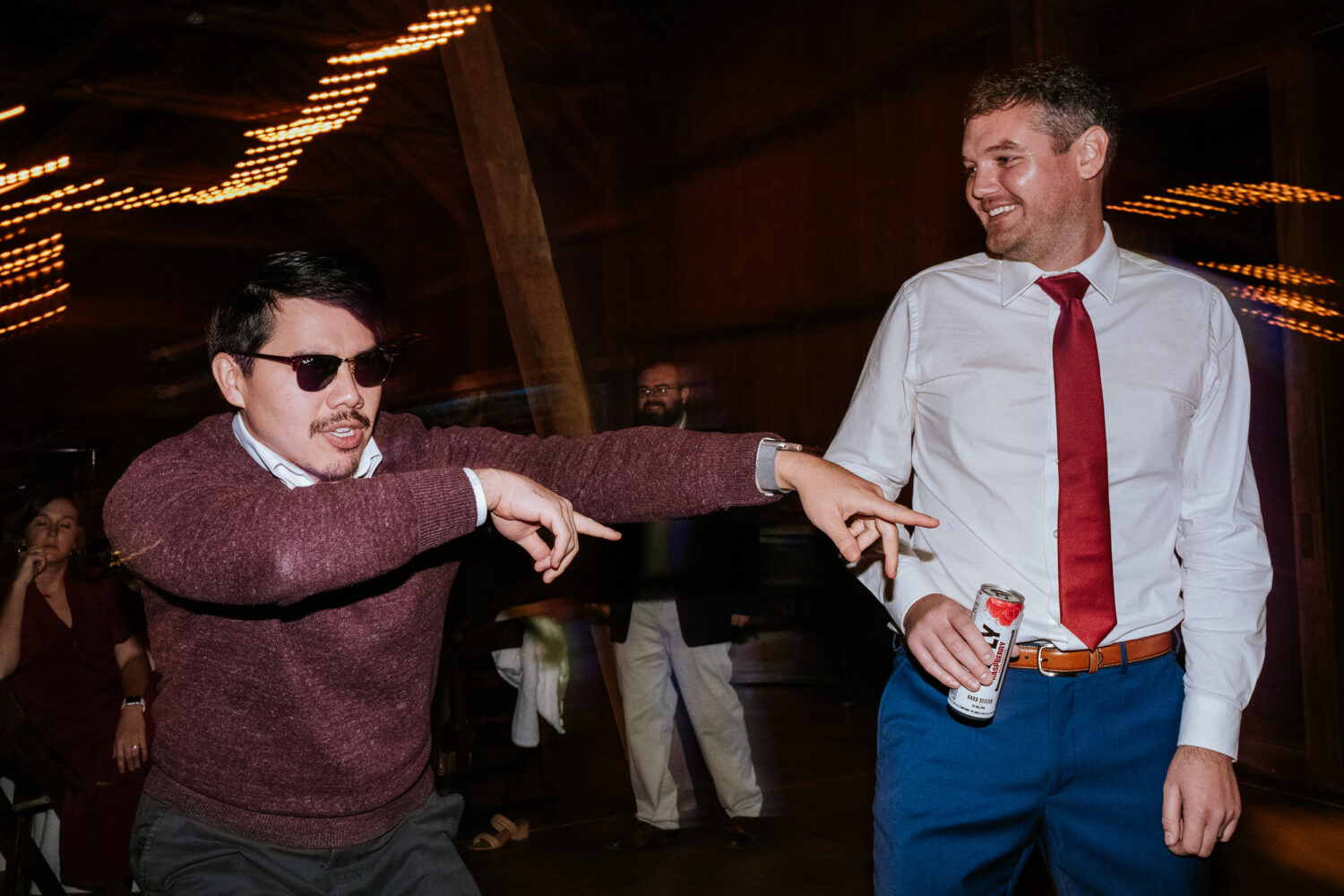 groom dancing with his best friend on the dance floor 