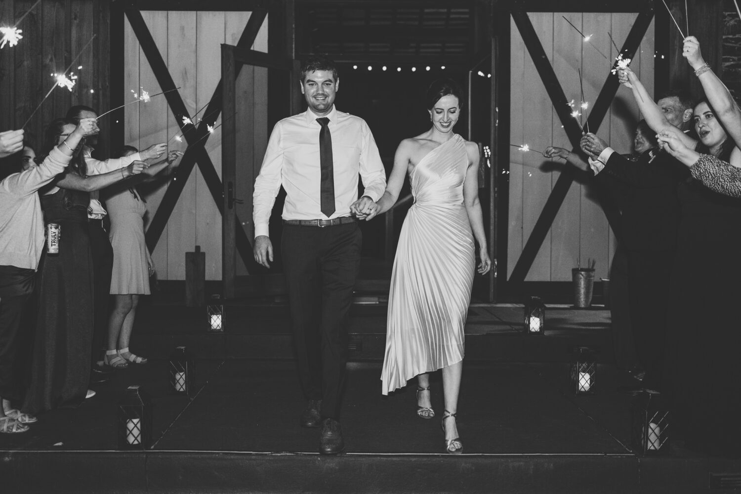 bride and groom leaving their Kalero Vineyard wedding day with a sparkler exit