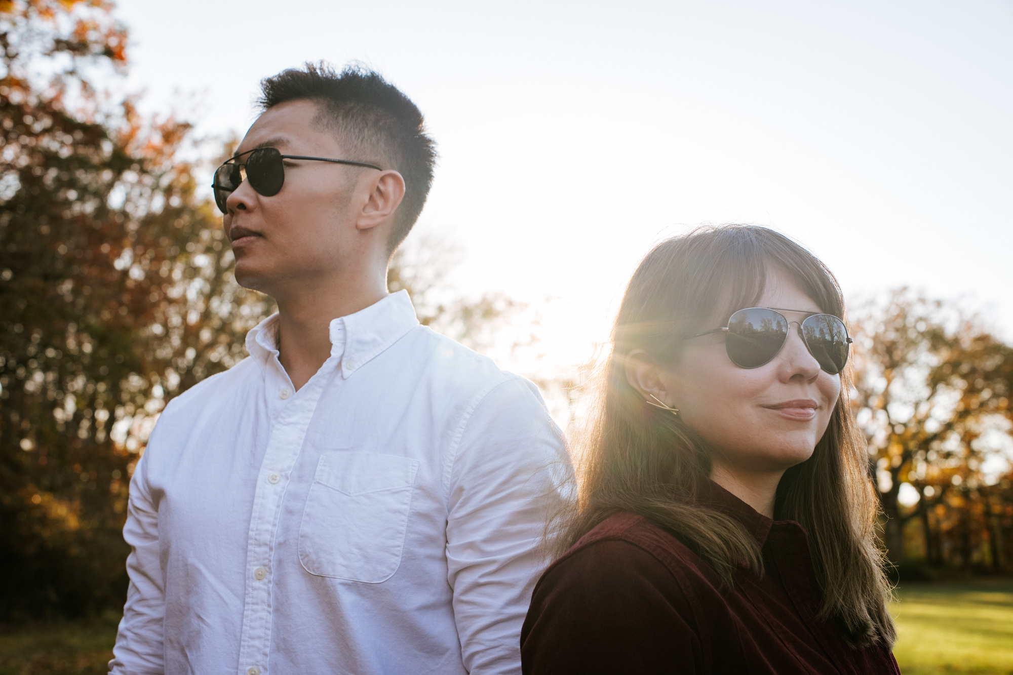 couple wearing sunglasses during sunset together