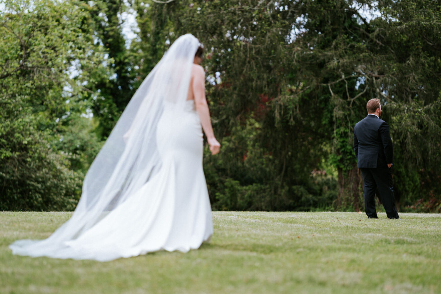 bride walking up to her groom for their first look on their wedding day in northern virginia