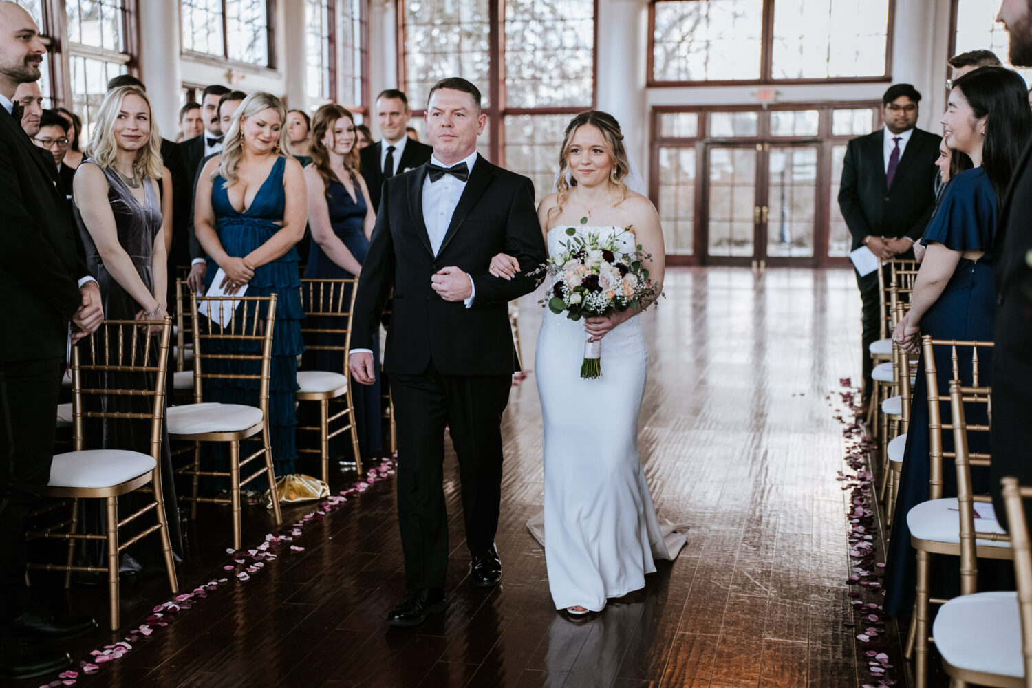 bride walking down the aisle with her father