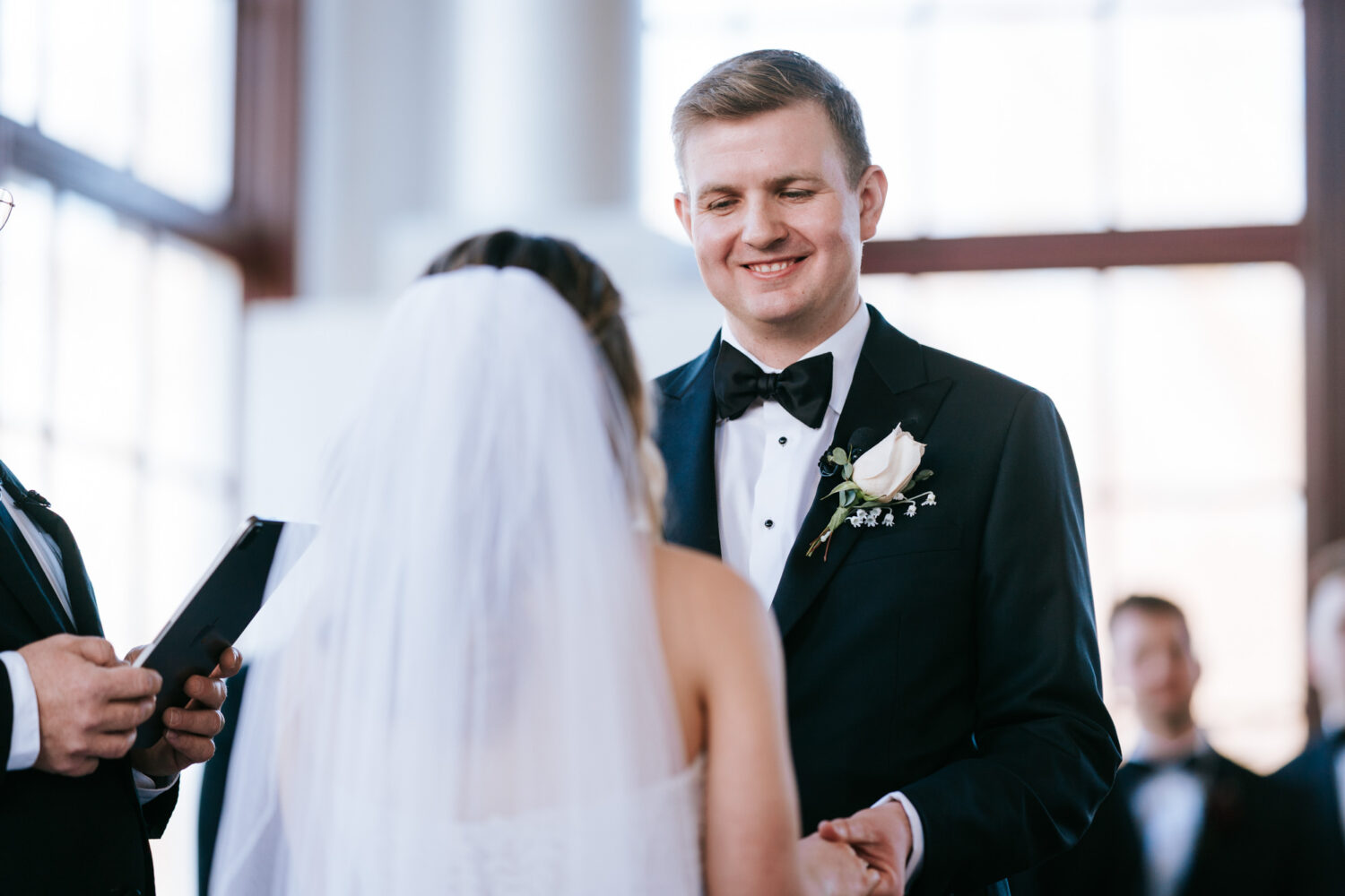 groom laughing during his ceremony