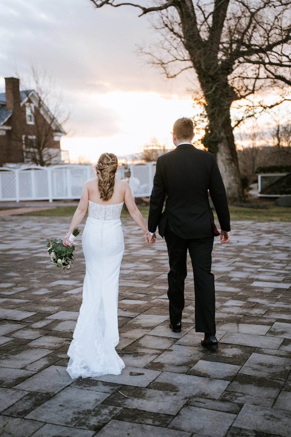 bride and groom walking away together