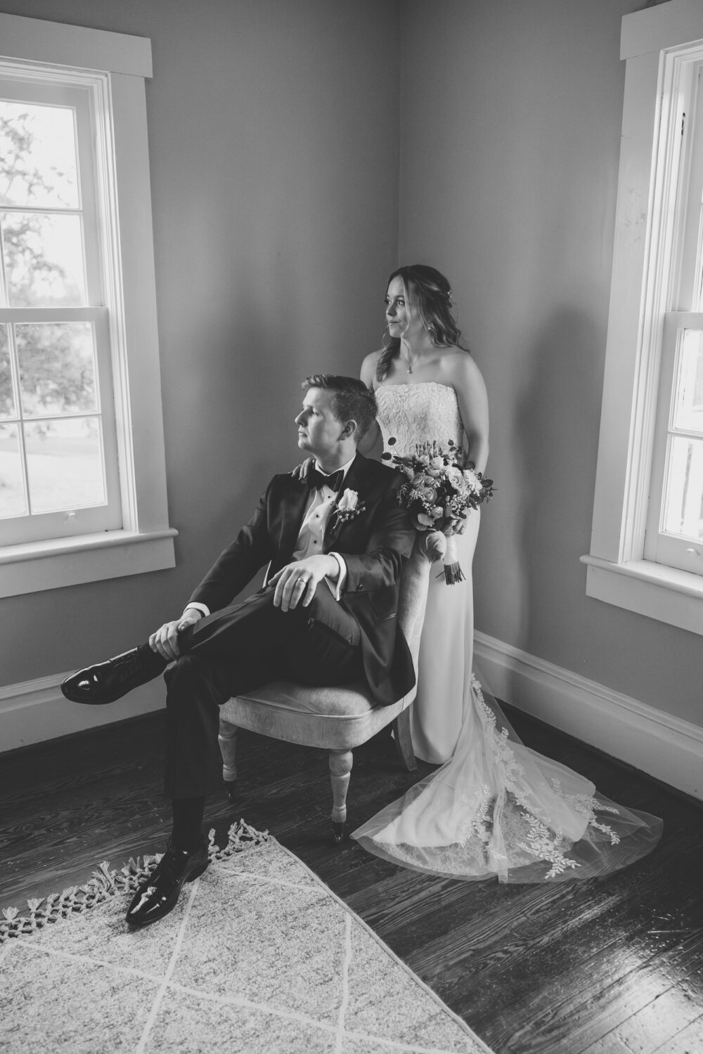 stoic bride and groom indoor portrait