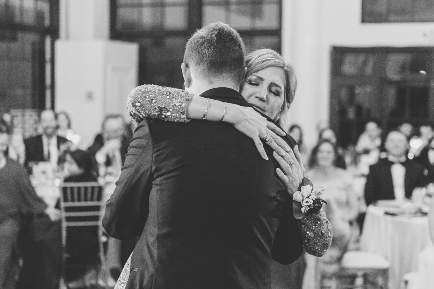 mother and son hug after dancing