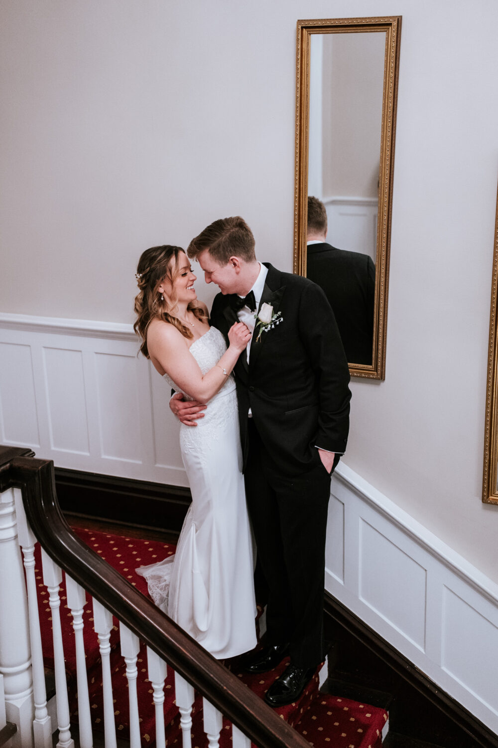 bride and groom interacting and smiling together