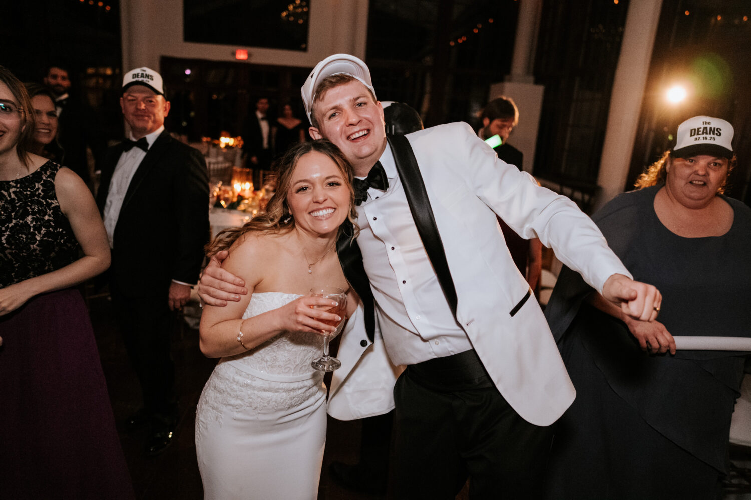 bride and groom smiling together on the dance floor