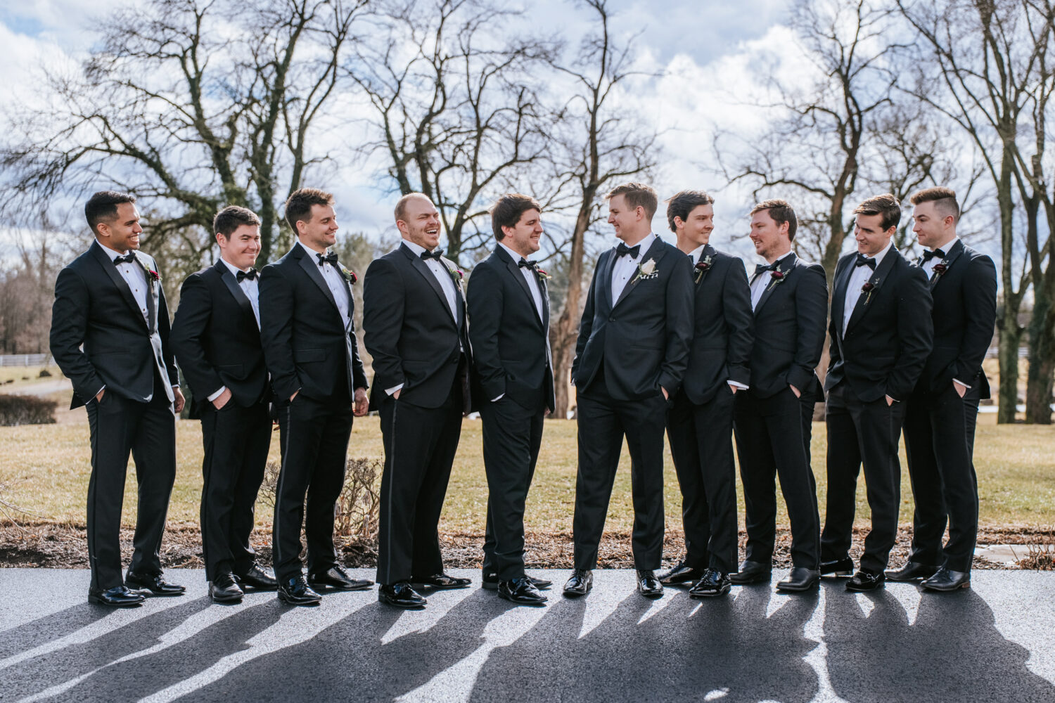 groomsmens smiling and laughing together