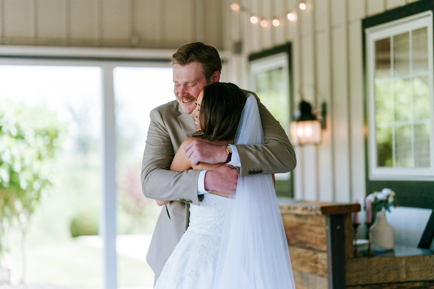 groom hugging his bride on their shadow creek wedding day