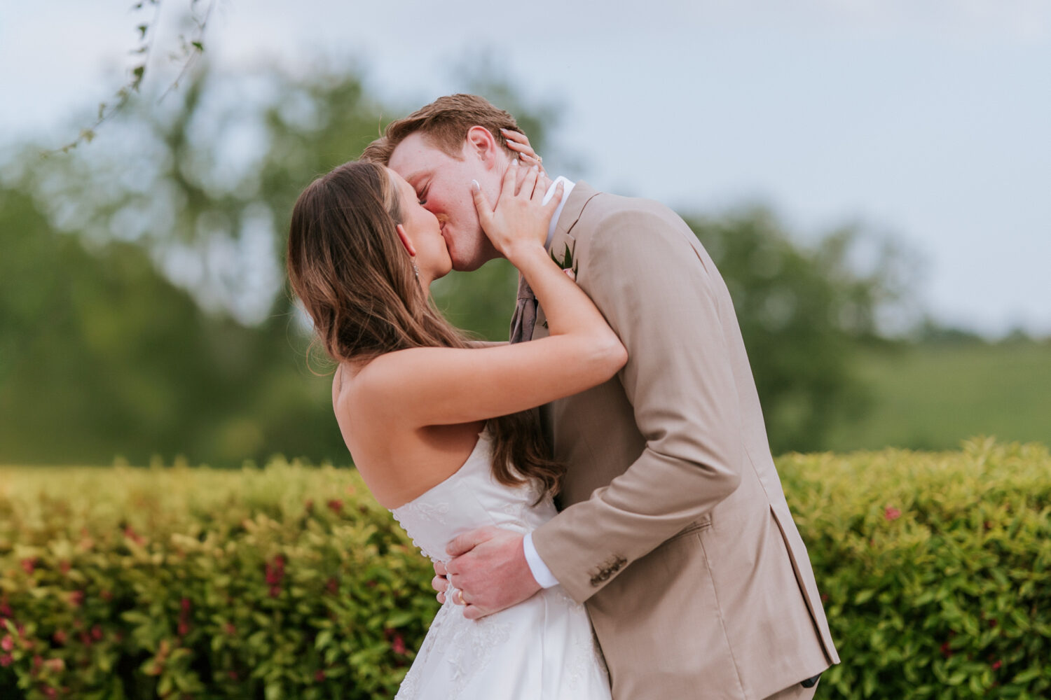 bride and groom first kiss