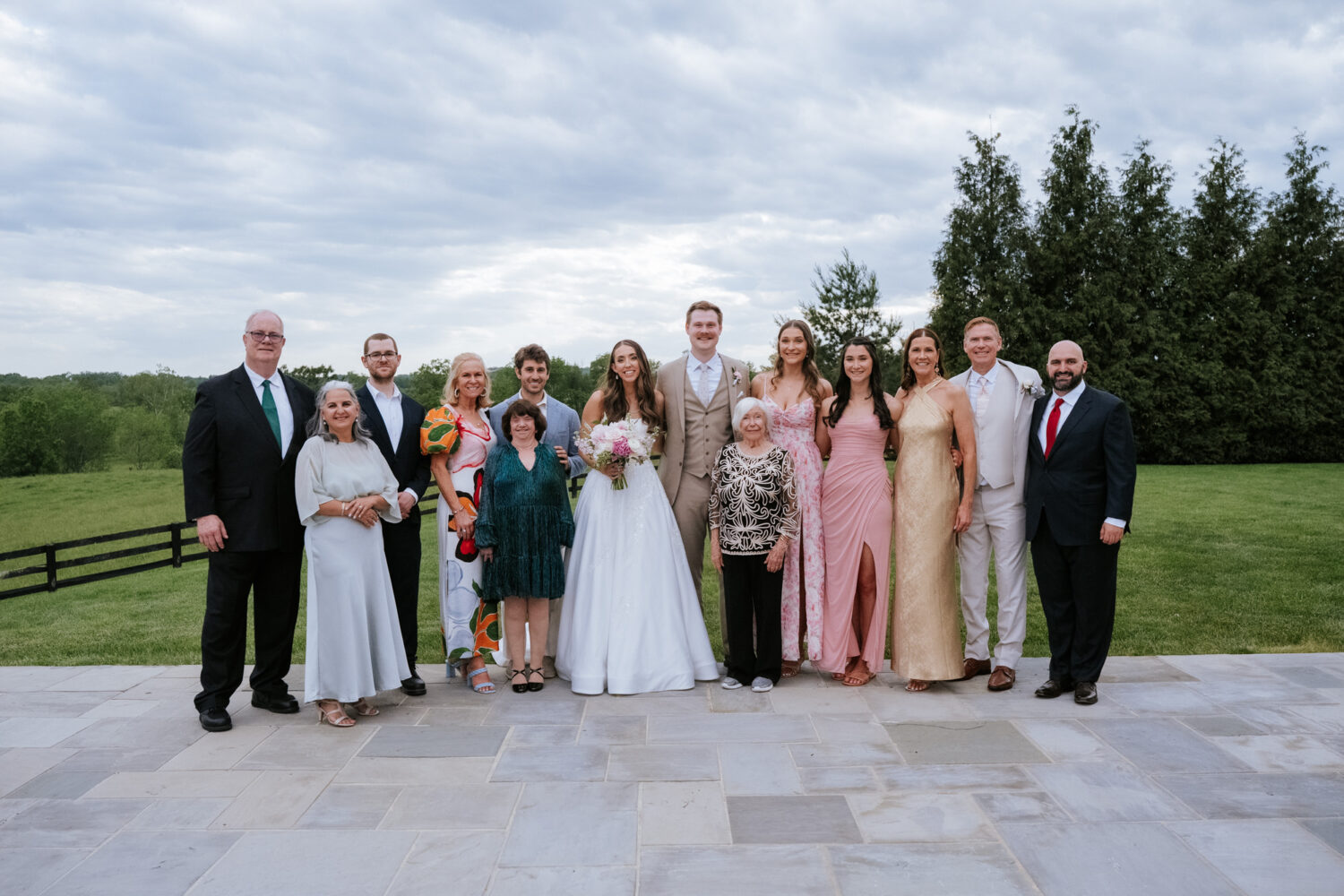 wedding day portrait of the groom's extended family