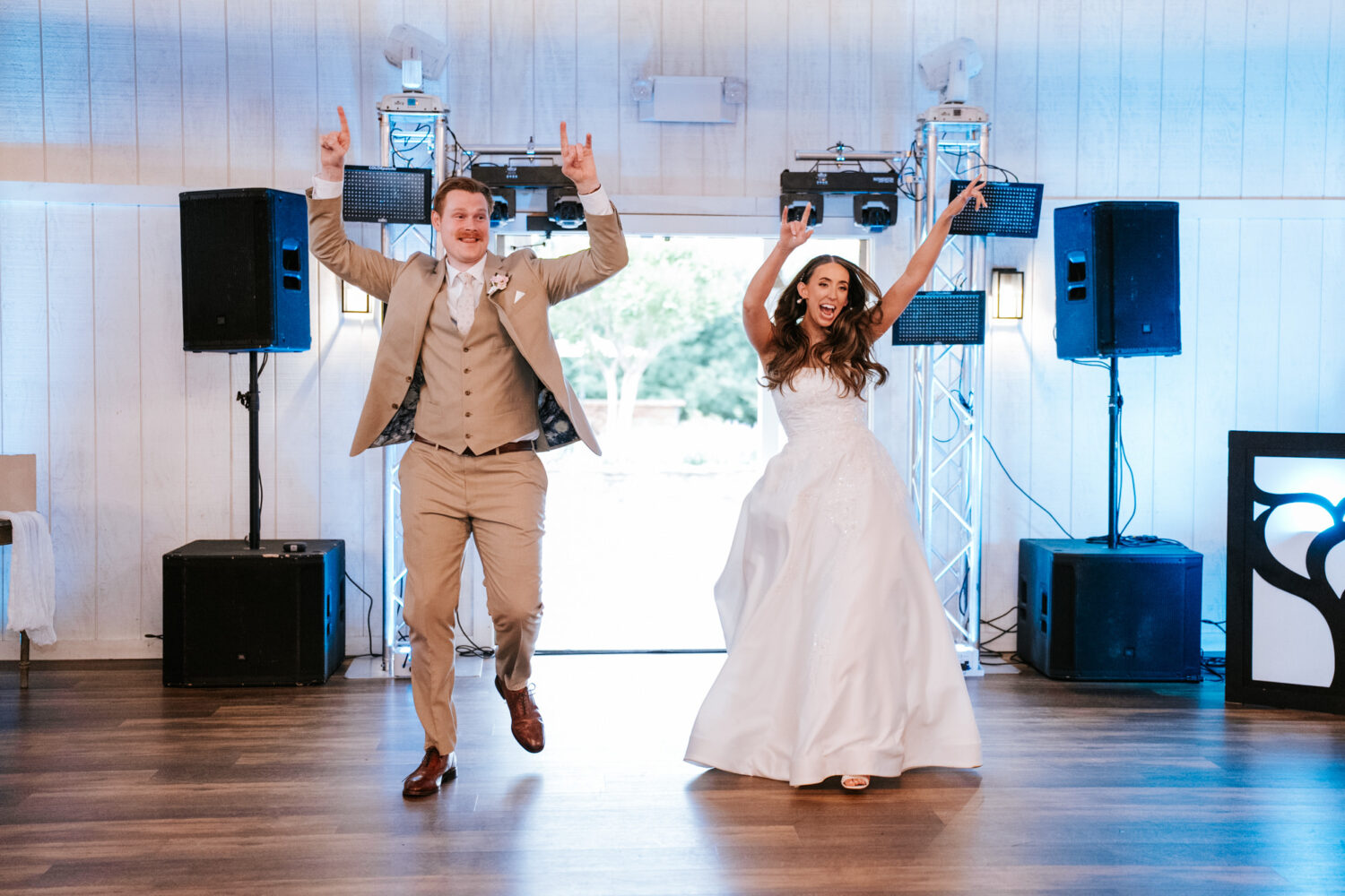 bride and groom entering their shadow creek wedding reception