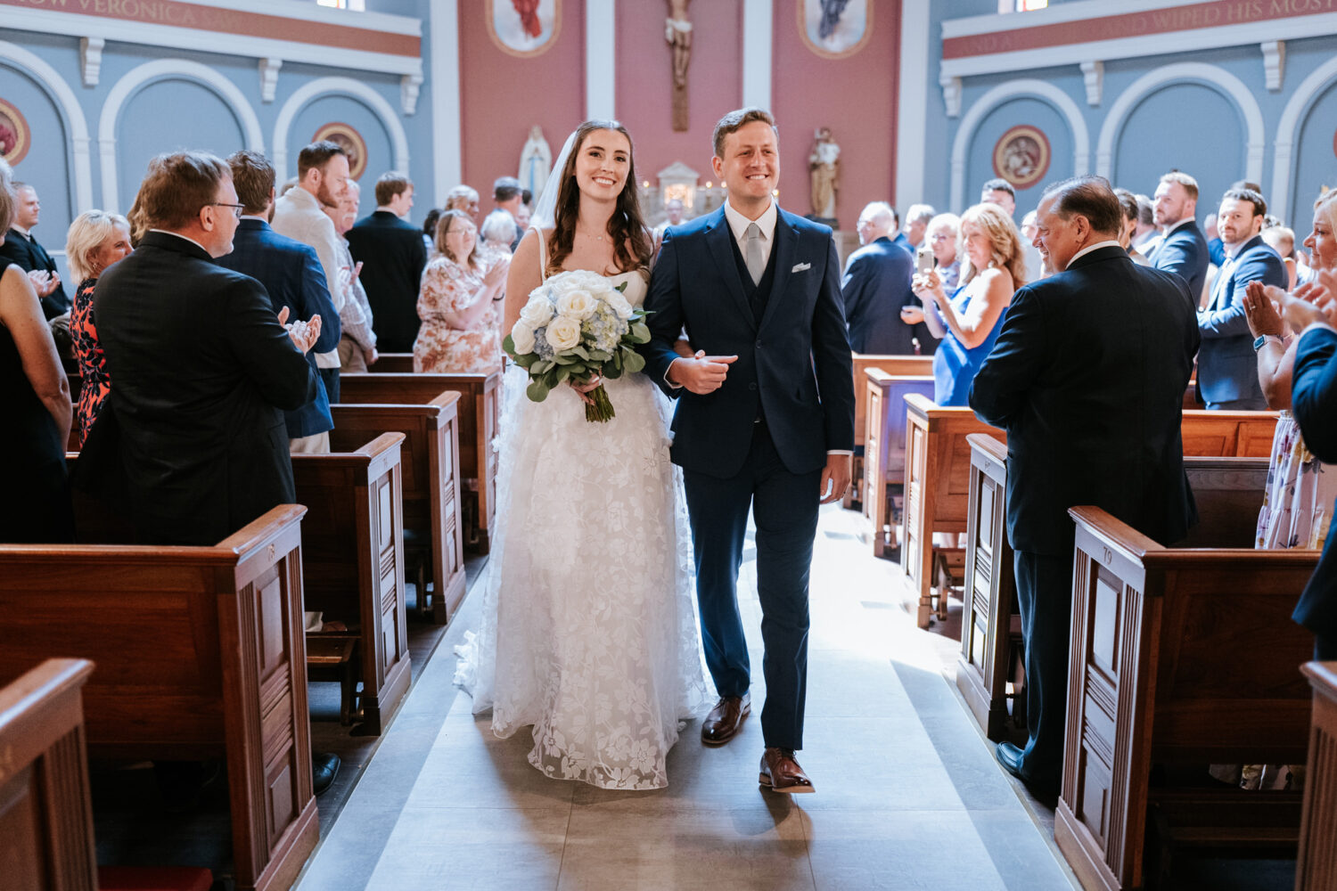 bride and groom smiling as the exit the northern virginia church wedding ceremony