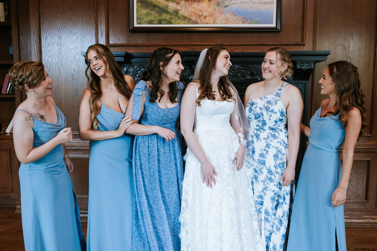 bride laughing with her bridesmaids