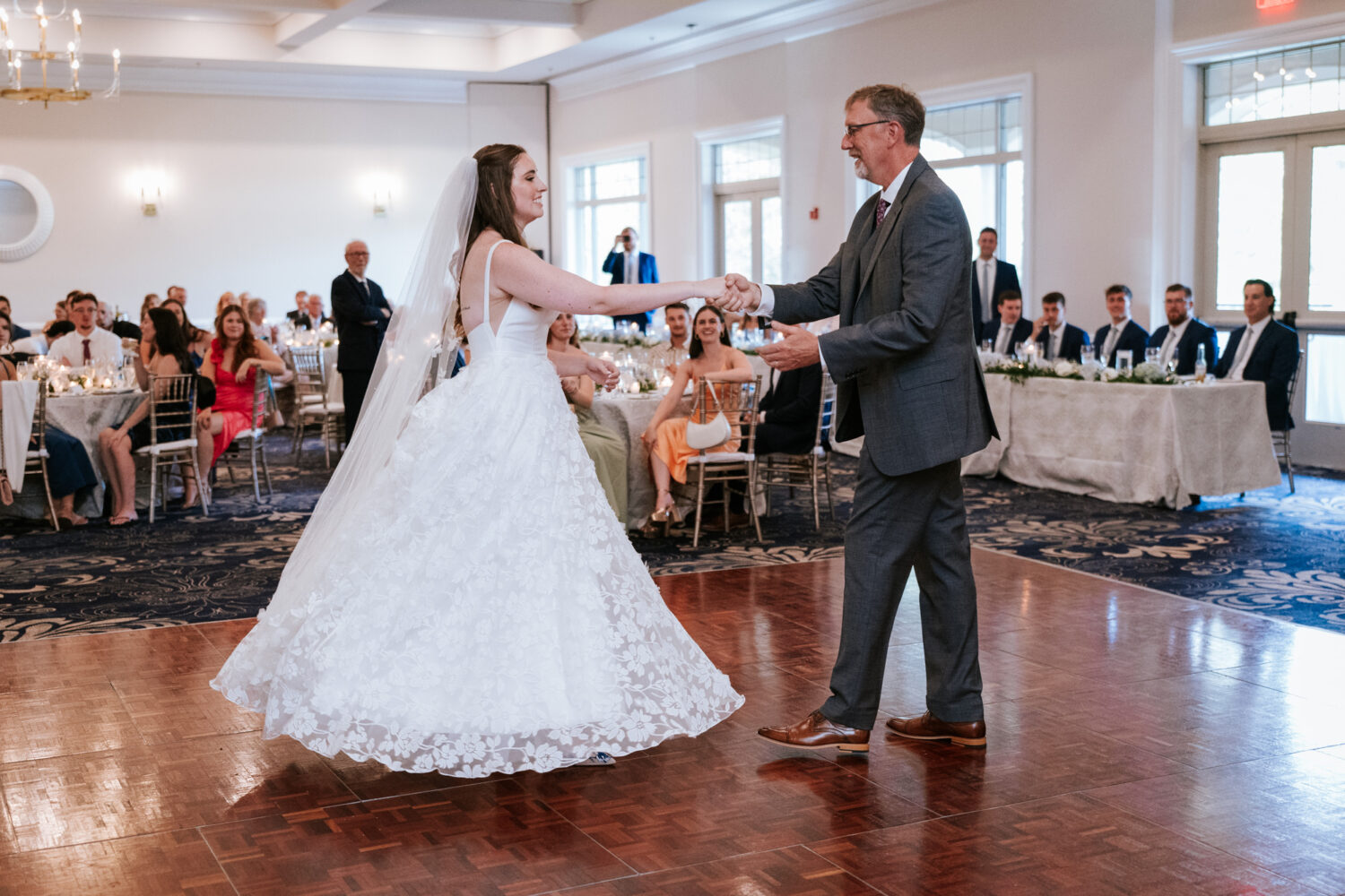 bride dancing with her father on her wedding day