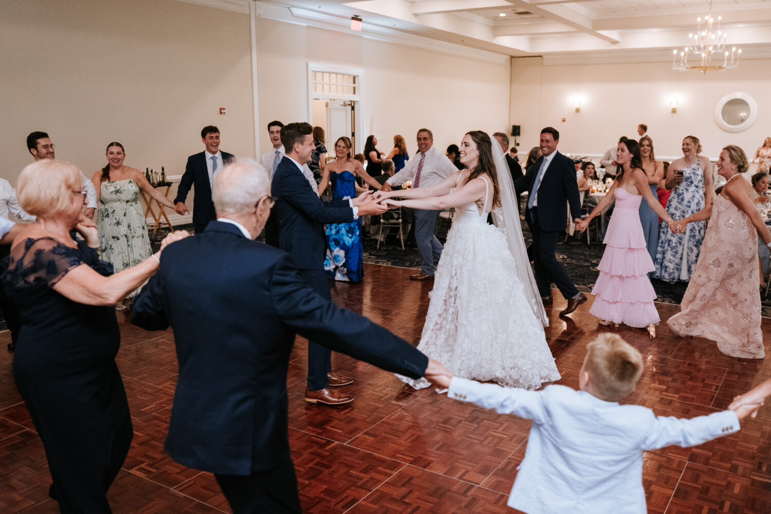 bride and groom dancing with their wedding guests